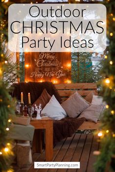 an outdoor christmas party with lights and pillows on the porch, surrounded by greenery