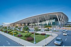 an airport with cars parked in front of it