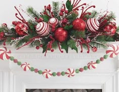 a mantel decorated with christmas decorations and candy canes in red, green and white