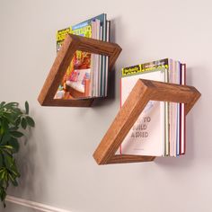 two wooden bookshelves with magazines on them and the words pinterest above them