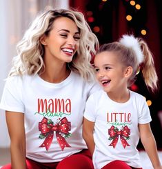 Celebrate the holiday season in style with these Mama Claus and Little Claus Matching Christmas Shirts! Featuring a cheerful red bow with festive holly accents, these shirts are perfect for moms and their little ones to spread holiday joy together. Available in both black and white options and in a range of sizes for adults, kids, and toddlers, this matching set is ideal for Christmas gatherings, family photo sessions, or cozying up by the tree. With a comfy fit and adorable holiday-themed desig Christmas Pic, Matching Christmas Shirts, Daughter Christmas, Bow Shirt, Christmas Gathering, Bow Shirts, Buffalo Plaid Christmas, Mom And Daughter, Family Photo Sessions