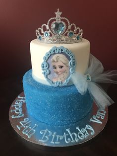 a birthday cake with a frozen princess tiara on top