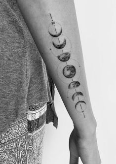 a woman's arm with phases on it