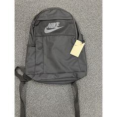 This Nike Elemental Backpack Is The Perfect Combination Of Style And Functionality. With A Zip Closure, This Unisex Sports Backpack Is Ideal For Travel Or Casual Use. Measuring 30 Cm (W) X 47 Cm (H) X 16 Cm (D) / 11.8" X 18.5" X 6.3" Inches, It Offers Enough Space For All Your Essentials. The Black Color And Polyester 100% Lining Material Give It A Sleek And Modern Look. Made Of High-Quality Polyester 100%, This Backpack Is Durable And Built To Last. Whether You're Going On A Hike Or Just Runnin Nike Black Backpack For Outdoor Activities, Nike Sports Backpack For Back To School, Nike Functional Backpack For Outdoor Activities, Nike Practical Backpack For Outdoor Activities, Practical Nike Backpack For Outdoor Activities, Sporty Nike Bags For Outdoor Activities, Back To School Sports Nylon Bag, Functional Gym Bag For Back To School, Back To School Sports Bags In Nylon