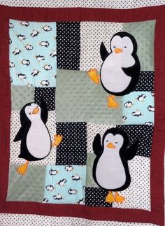 a quilt with penguins on it