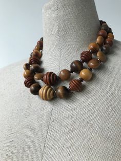 Incredible vintage necklace in excellent condition. Make a statement with two beautiful strands of artfully shaped wooden beads. 70s Accessories Jewelry, 70s Accessories, Wood Beads Jewelry, Pony Bead Projects, Wooden Bead Necklaces, Necklace Shop, Wood Necklace, Pony Beads, Multi Strand Necklace