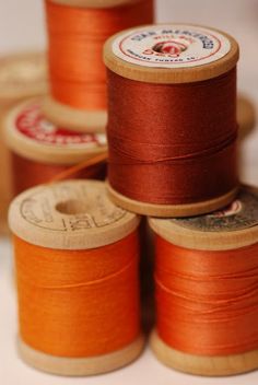 several spools of thread with different colors