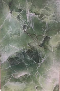 an abstract painting in shades of green and grey with white swirls on the surface