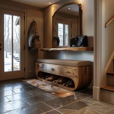 a wooden bench sitting under a mirror next to a stair case with shoes on it