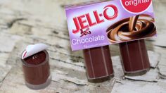 two jars of jello chocolate sitting next to each other