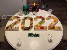 a table with the numbers 2012 spelled out on it and some wine glasses sitting next to it