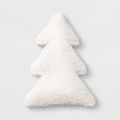 a white pillow shaped like a christmas tree