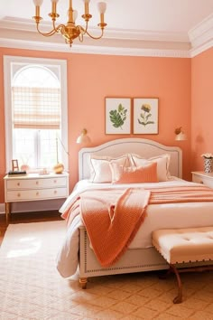 a bedroom with peach walls and white furniture