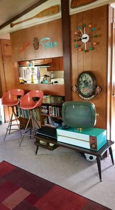 a living room filled with furniture and a tv