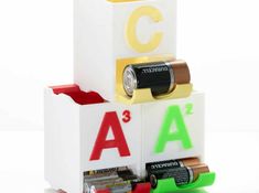 three batteries stacked on top of each other with the letters abc and c in them