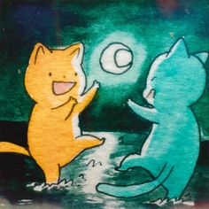 two cats are playing with each other in the night time scene, one cat has its paw up to another cat's head