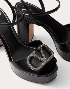 Valentino Garavani platform sandal in calfskin with VLogo Signature decoration - VLogo Signature accessory with crystal appliqué - Leather-covered block heel and platform - Heel height: 115 mm / 4.5 in. with 35 mm / 1.4 in. platform - Made in Italy Couture Perfume, Escape Bag, Studded Sneakers, Woman In Black, Oxford Boots, Wedge Loafers, Valentino Rockstud, Platform Heel, Boot Accessories