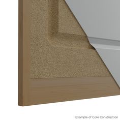 an angled view of the corner of a door with carpet on it and white trim