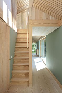 a wooden staircase leading up to the second floor