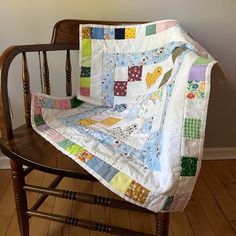 a chair with a quilt on top of it