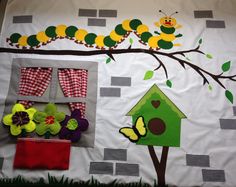 the very hungry caterpillar is hanging on the wall next to the flower pot