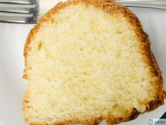 a piece of cake sitting on top of a white plate next to a knife and fork