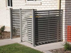 a metal gate on the side of a house