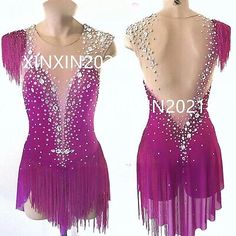 an image of two women's ballroom dresses on mannequins with beading