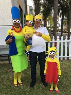 the family is dressed up in costumes for halloween