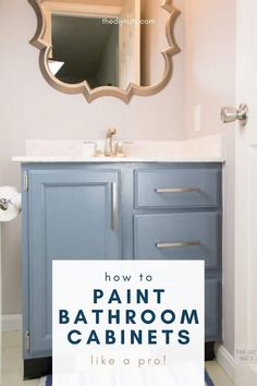 a bathroom with blue cabinets and a mirror above it that says how to paint bathroom cabinets like a pro