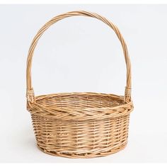 a wicker basket with handles on a white background