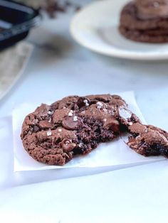 a chocolate cookie is cut in half on a table