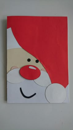 a piece of paper that has been cut out to look like a santa claus face