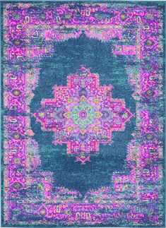 a blue and pink area rug with an ornate design on the center, in front of a