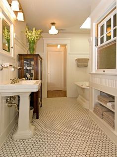 a bathroom with a sink, toilet and bathtub