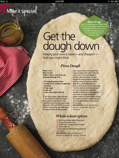 a pizza dough sitting on top of a table next to a rolling pin