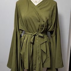 Flare Sleeves; Wrap Closure With A Matching Belt; Olive Green Casual Green Wrap Top, Casual Green Wrap Blouse, Casual Wrap Blouse For Spring, Solid Wrap Top For Spring, Long Length Blouse, Plunge Blouse, Satin Cami Top, Fishnet Top, Maxi Shirts