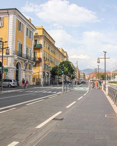 a city street with people walking on the sidewalk