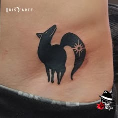 a woman's stomach with a tattoo of a fox on it