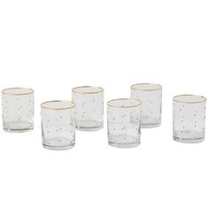 set of six glasses with gold dots on the rim and bottom, all in different sizes