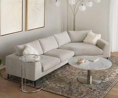 a living room with a sectional couch and coffee table