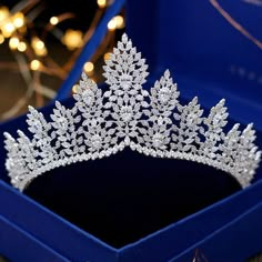 a tiara in a blue box on a table