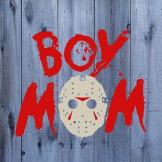 a wooden fence with the words boy, man and a hockey mask painted on it