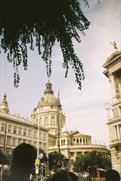 people are standing in front of some buildings