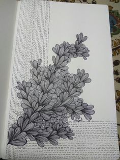 an open book with flowers drawn on it