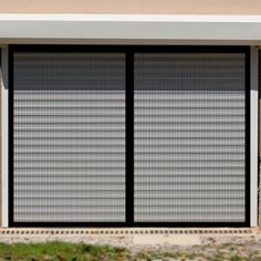 an open garage door on the side of a building