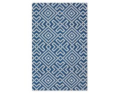 a blue and white rug with an abstract design