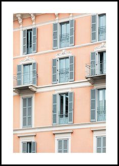 an apartment building with many windows and balconies