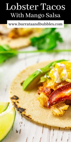 lobster tacos with mango salsa on a tortilla