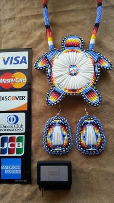 an assortment of beaded items including a cell phone, credit card and earring